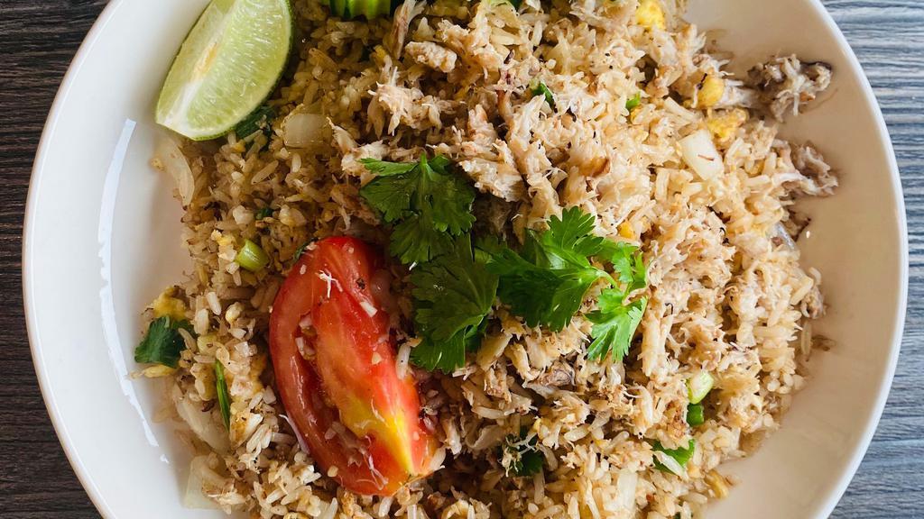 Crab Fried Rice · Blue crab meat fried rice, tomato, garlic, onion, green onion, egg.