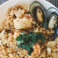 Tom Yum Fried Rice Talay · Mussel, prawn, calamari fried rice with kaffir lime leafs, lemon glass, egg, tomatoes, mushr...