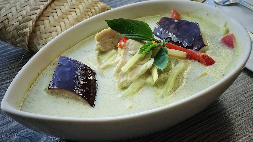 Green Curry · Thai green curry with bell pepper, bamboo shoot, 
eggplant and basil.