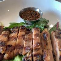 Gai Yang · Grill BBQ chicken come with Thai spicy sauce and served with sticky rice.