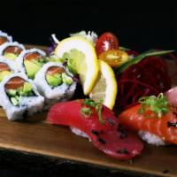E9 · 4 Pcs Sushi + 1 Regular Roll<br />*Chef's Choice of Sushi<br />Served w/ 1 Miso Soup