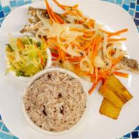 Escovitch Fish · Fried Caribbean snapper, covered in a pickled vinegar sauce of peppers and onion and carrots...