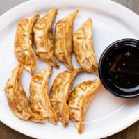 Pork Dumplings (8) · Pan fried pork and vegetable dumplings, served with sweet and sour chili sauce.