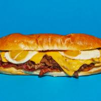 Breakfast Cheesesteak · Sliced steak with melted cheddar, crispy bacon, and a fried egg on a hoagie roll.