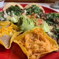 Street Tacos · Five soft corn tortillas served with sliced steak. Served with onions, cilantro and special ...