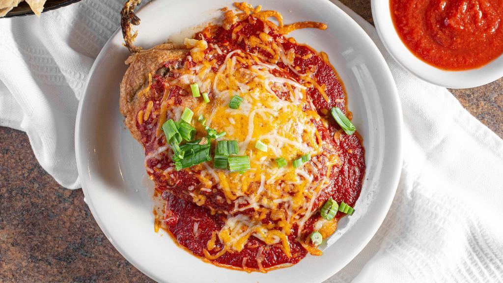 Chile Relleno · Large breaded and fried pepper stuffed with melted cheese. Topped with our signature red sauce, melted cheeses and green onions. Add your choice of protein!