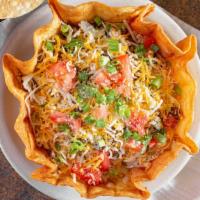 Taco Salad · Large fried flour shell filled with lettuce, tomato, shredded cheese, green onion and parmes...