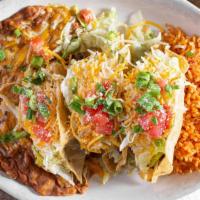 #3 · Tacos! Tacos! Tacos! Three cripsy beef, chicken or a combo of both tacos. Served with refrie...