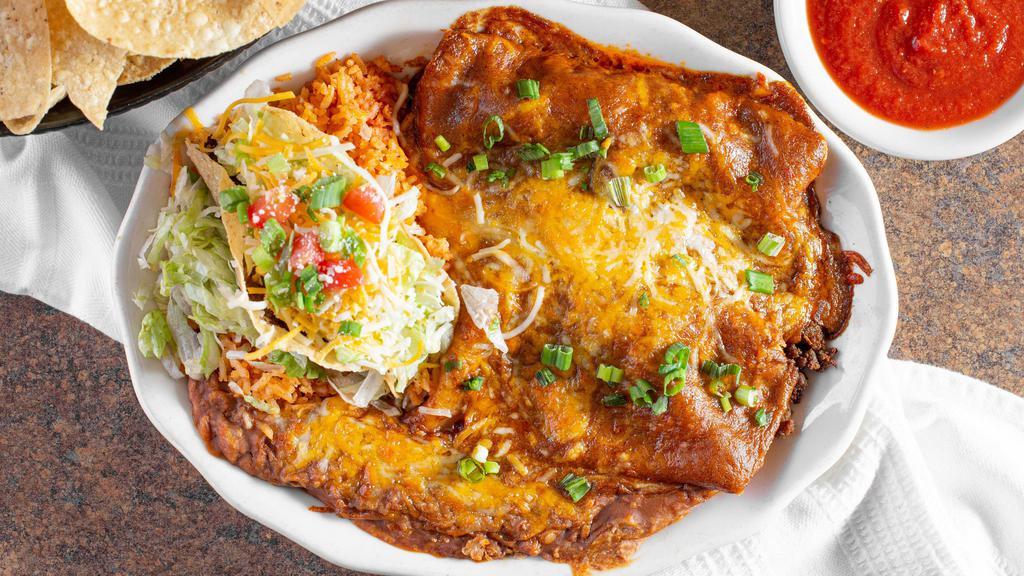 #5 · El Pollo. Two chicken, cheese and onion enchiladas and a crispy chicken taco. Served with refried beans and rice.