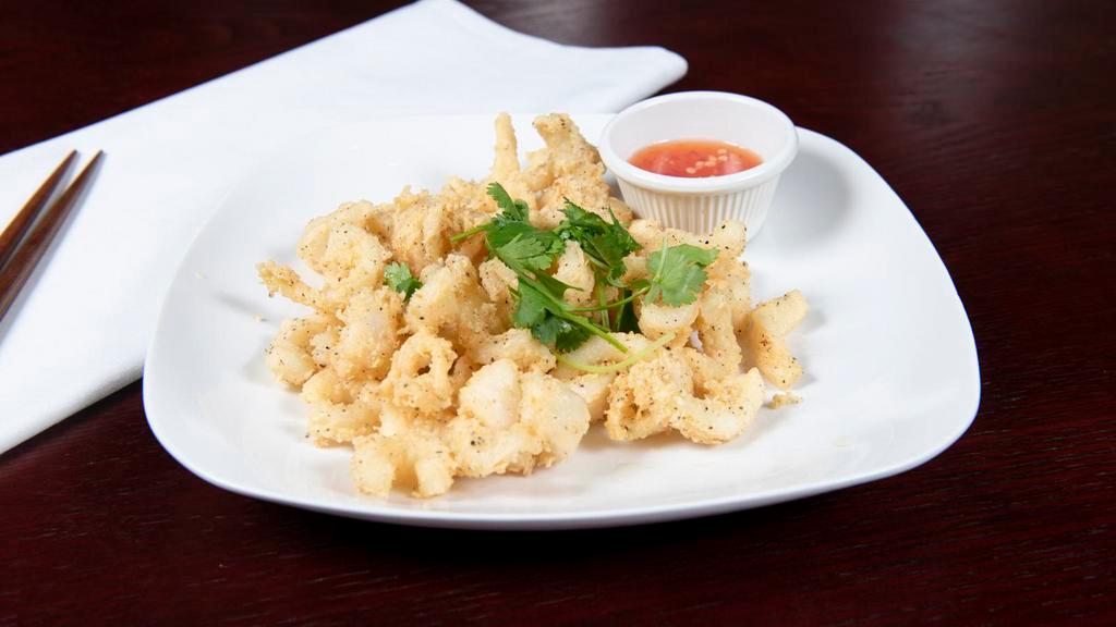 Crispy Calamari · Crispy calamari in light batter with our signature chef sauce.