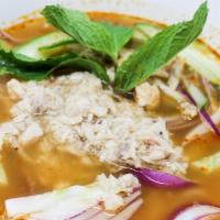 Penang Assam Laksa Noodle Soup · Noodle soup with tuna in sweet, spicy and sour broth topped with cucumber, fresh onions, and...
