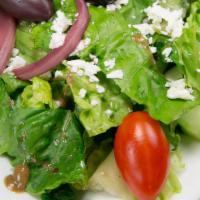 Greek Salad · Izmir balsamic dijon dressing, topped with feta cheese (vegan: ask for no cheese)
