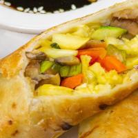 Veggie Piroshki · Crispy veggie roll with sesame soy sauce.