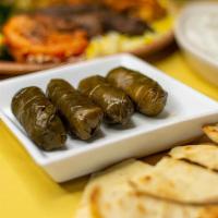 Meat Dolmas · Grape leaves stuffed with beef, rice, and spices.
