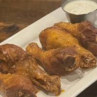 Buffalo Drummies · Wing-sized chicken drumsticks tossed with house buffalo sauce served with your choice of ran...