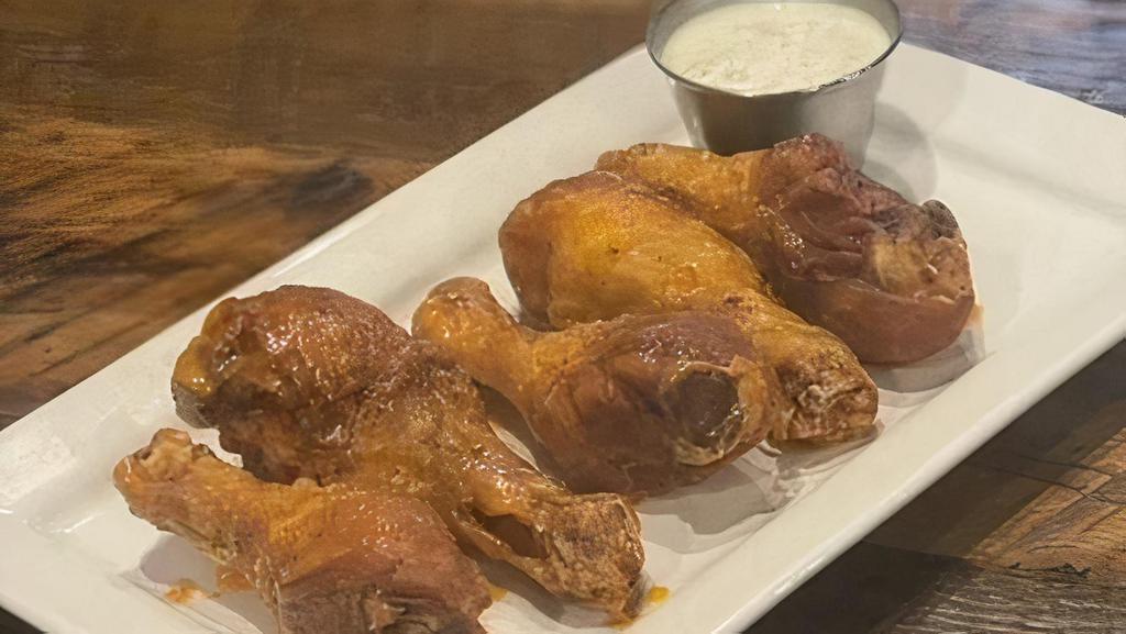 Buffalo Drummies · Wing-sized chicken drumsticks tossed with house buffalo sauce served with your choice of ranch or bleu cheese
