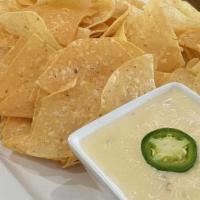 Pepper Jack Queso · Corn tortilla chips and pepper jack queso
