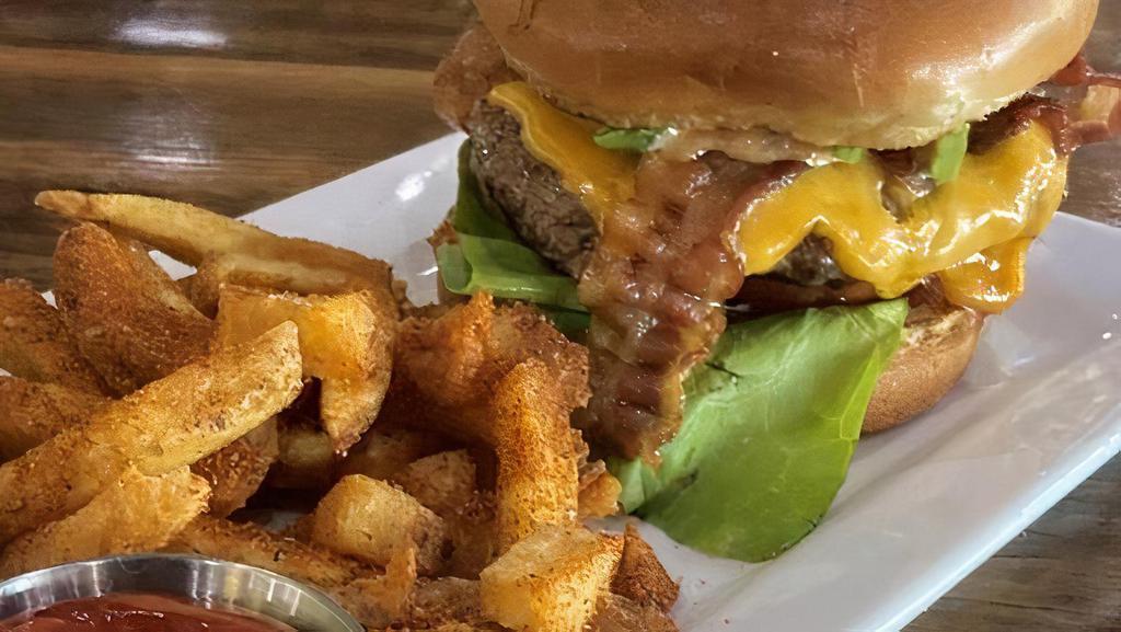 Spicy Avocado · Certified Angus Beef patty, avocado, applewood smoked bacon, cheddar, bibb lettuce, tomato and chipotle cilantro mayo.