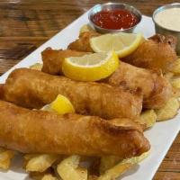 Fish & Fries · Amber ale battered cod fillets, hand -cut fries and tartar sauce