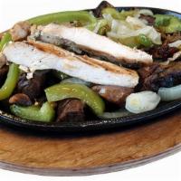 Sizzling Hot Fajitas For One · Grilled to perfection with grilled onions, mushrooms, and bell peppers served with guacamole...