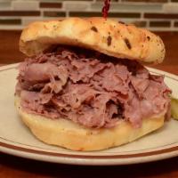 Corned Beef Sandwich · Our delicious corned beef on an onion roll or rye with mustard and pickle.