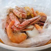 Famous Low Country Boil · Half pound snow crab legs, half pound shrimp (no head), half pound all-meat sausage, one boi...