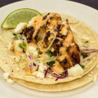Blackened Rockfish Tacos	 · Gluten-free. White corn tortillas, napa slaw, chipotle aioli, cotija cheese, and pico de gal...