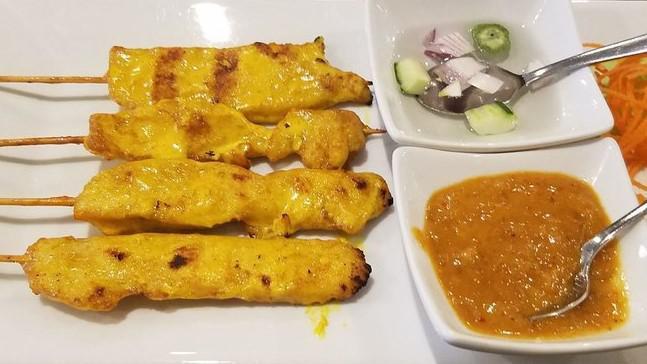 Chicken Satay · Grilled skewered chicken served with Thai peanut sauce and cucumbers relish.