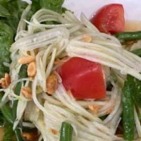 Sl5 Papaya Salad · Gluten free. Shredded green papaya, tomatoes, green bean, and peanut in lime dressing served...
