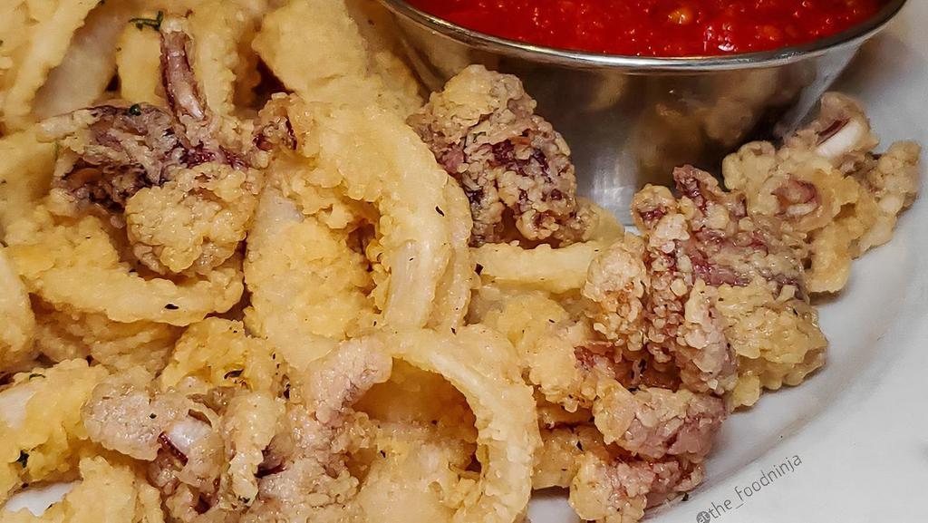 Calamari Fritti · Lightly breaded and fried calamari served with marinara sauce.