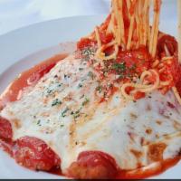 Chicken Parmigiana · Chicken breaded and fried, topped with mozzarella, tomato sauce and accompanied by spaghetti.