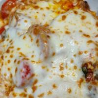 Chicken Margherita · Chicken breast sautéed with fresh mushrooms, tomatoes, basil, and fresh Mozzarella served ov...