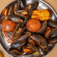 Black Mussel [Special] · 1/2b black mussel, 1/21b snow crab, 1/21b headless shrimp. 1/4 lb sausage, two corn two pota...