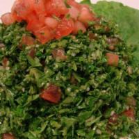 Tabouleh · Chopped tomatoes, onions, mint, parsley, bulgur, and tossed with a delightful mixture of oli...