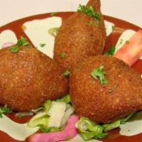 Kibbeh · Three fried ground beef shells combined with cracked wheat stuffed with a mixture of sautéed...