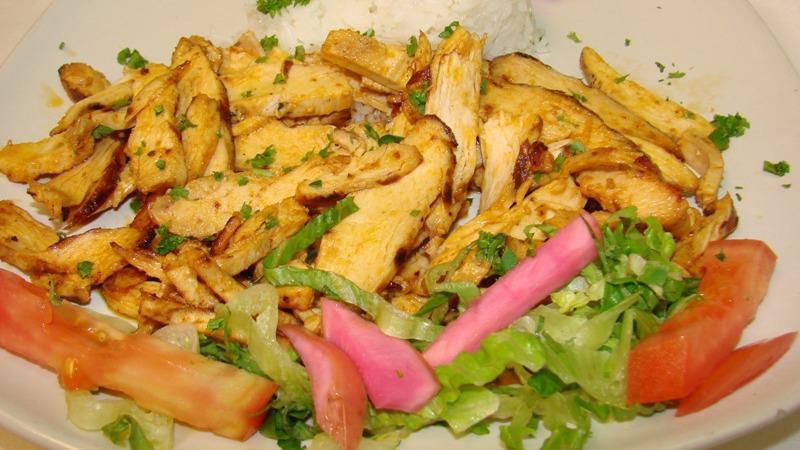 Chicken Shawarma · Boneless chicken specially marinated and grilled served over pita and garlic sauce.