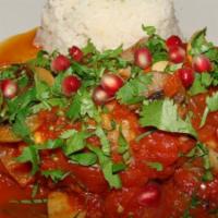 Layalina Lamb Shank · Simmered in fresh tomato, mushrooms, and garlic in a pomegranate-lemon sauce, sprinkled with...