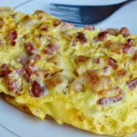Meat-Lover Omlette · Any two vegetables with cheese, sausage, bacon, and ham.