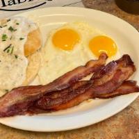 1 Biscuit & Gravy Combo · Served with two eggs and your choice of ham, bacon or sausage.