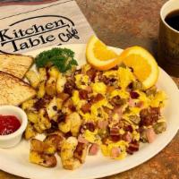 Meat Lovers Scramble · Three scrambled eggs loaded with ham, bacon and sausage.