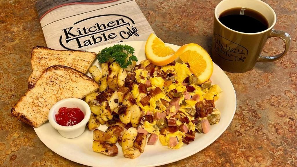 Meat Lovers Scramble · Three scrambled eggs loaded with ham, bacon and sausage.