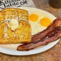 French Toast Combo · Thick bread dipped in egg batter and grilled golden brown. Served with two eggs and your cho...