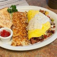 Kitchen Omelet · Four eggs omelet style. Stuffed with Bacon, sausage, mushrooms, bell peppers, onions and pot...