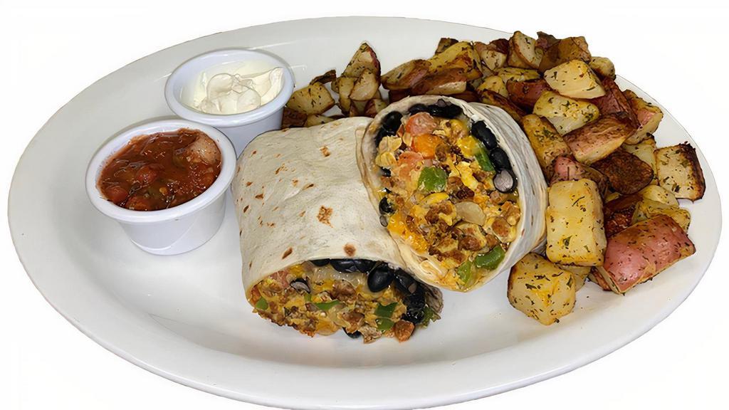 Breakfast Burrito · Scrambled eggs, peppers, onions, tomatoes, chorizo, black beans, roasted yellow corn, cheddar and jack cheese wrapped in a warm flour tortilla. Served with sour cream and salsa.