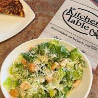 Caesar Salad · Fresh romaine mixed with parmesan cheese, croutons and Caesar dressing.