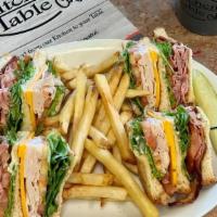 Classic Club · Triple decker sandwich with thin sliced turkey, ham, bacon, cheddar cheese, lettuce, tomato ...