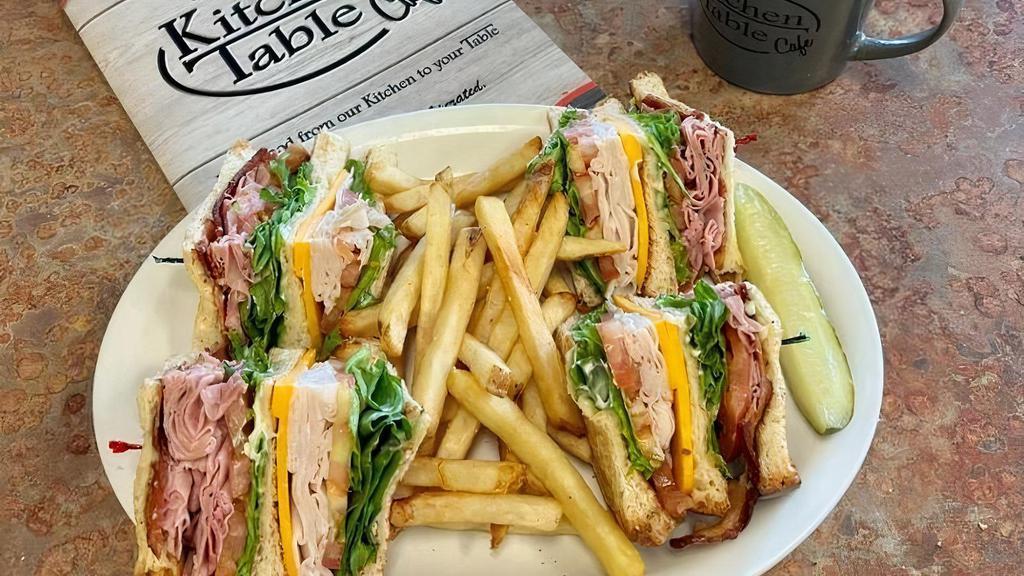 Classic Club · Triple decker sandwich with thin sliced turkey, ham, bacon, cheddar cheese, lettuce, tomato and mayo on toasted sourdough.