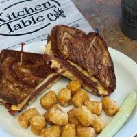 Reuben Beef · Thin sliced corned beef, sauerkraut, swiss cheese and thousand island dressing on grilled ma...