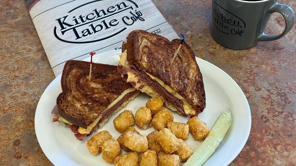 Reuben Beef · Thin sliced corned beef, sauerkraut, swiss cheese and thousand island dressing on grilled marbled rye bread.