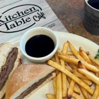French Dip · Thin sliced roast beef or turkey with melted swiss cheese on ciabatta bread. Served with ric...